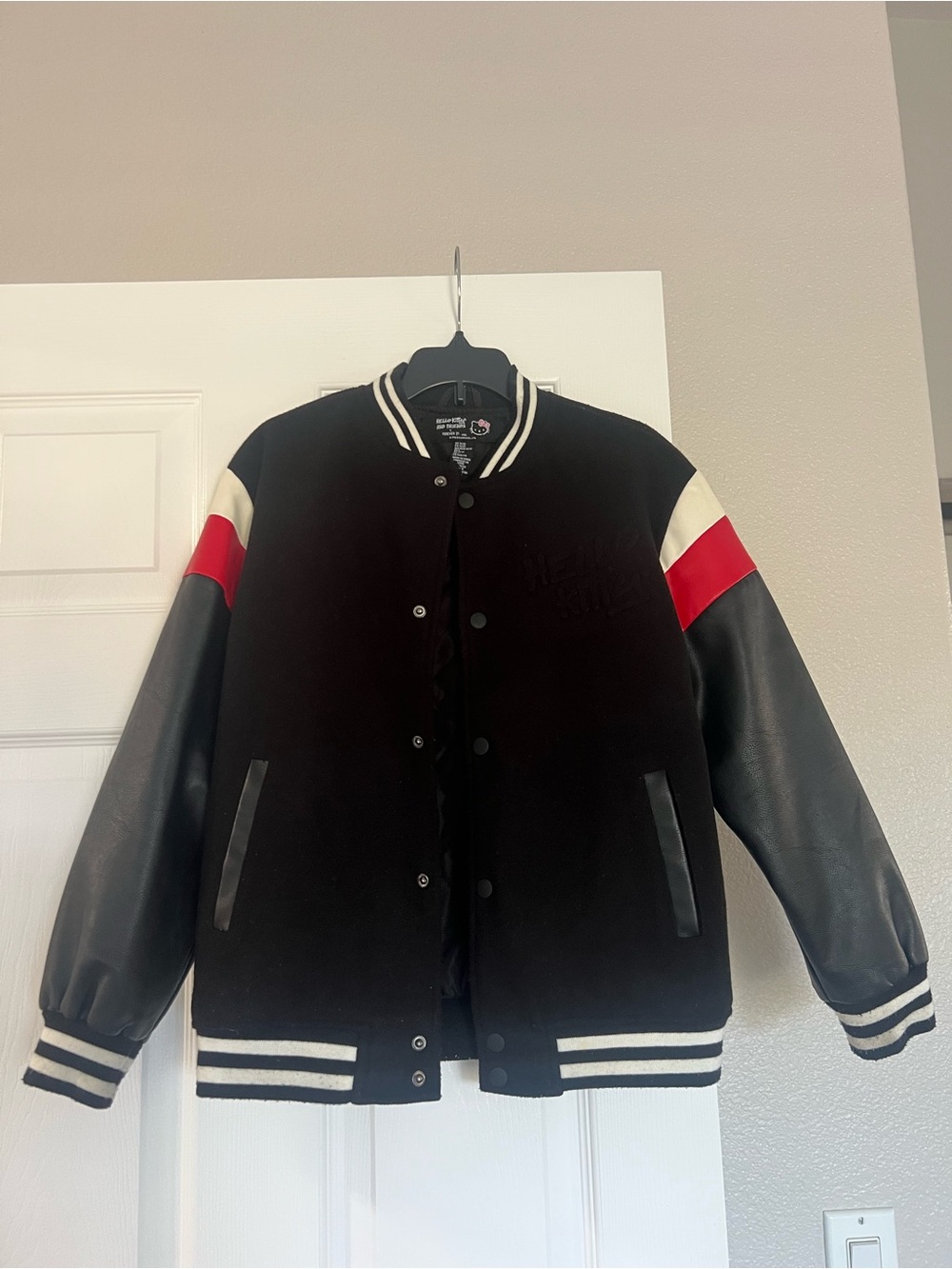 Gently worn girl’s Sanrio-Hello Kitty Black Varsity Jacket size 11/12